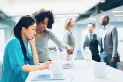 Multiracial business woman collaborating at work picture 