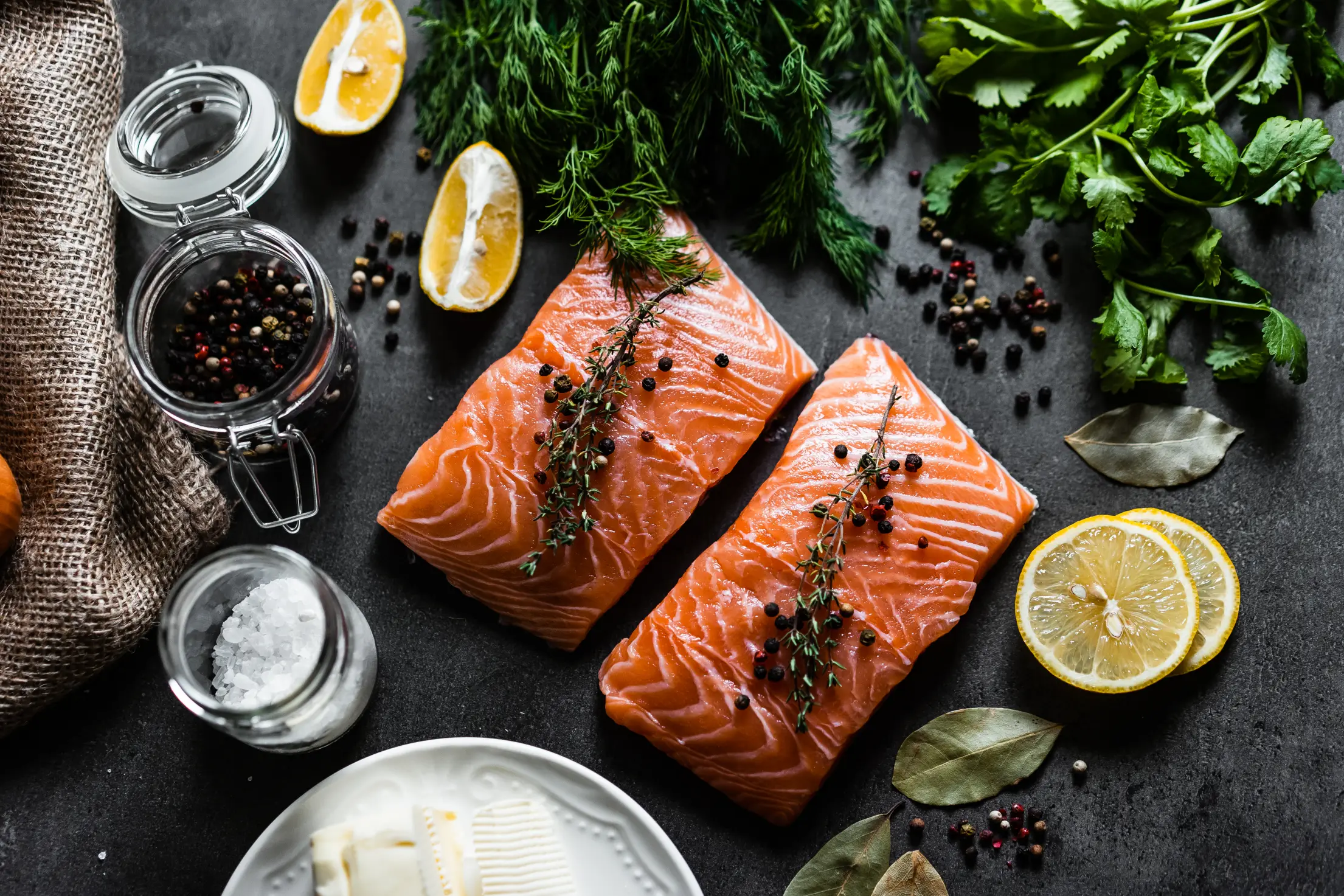 raw salmon fillets and ingredients for cooking