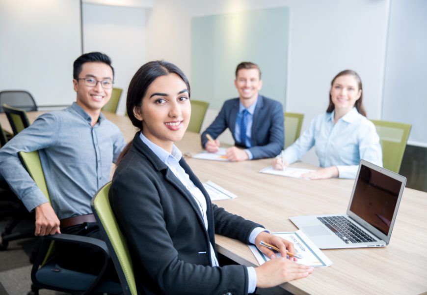 Smiling business lady working with colleagues.jpg